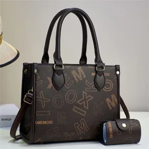 Detail view of a stylish dark brown leather tote bag with matching card pouch and letter print.