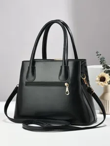 Stijlvolle zwarte dames handtas schoudertas crossbody tas met goudkleurige hardware.