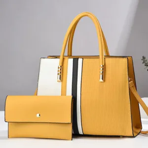 Detailgezicht van de colorblock handtassenset met bijpassende clutch en gouden details.