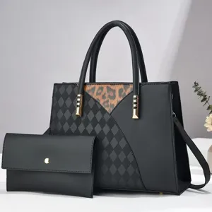 Details of the stylish black patchwork tote bag with geometric diamond and leopard print.