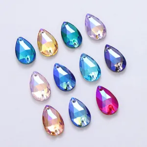 Close-up of vibrant drop-shaped AB glass sew-on rhinestones for DIY crafts and apparel.