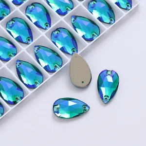 Close-up shot of teardrop AB glass sew-on rhinestones in grid box, sparkling DIY parts