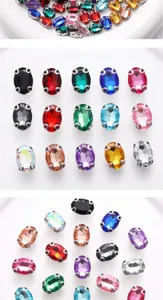 Primo piano dettagliato di strass in vetro ovale colorato con montatura ad artiglio in metallo.