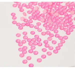 Close-up of pink flatback rhinestones, sparkling crystal gems for DIY crafts and nail art.