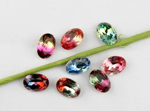 Close-up detail of colorful oval faceted crystal tourmaline DIY jewelry accessories stones.
