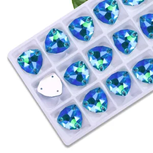 Detailed view of blue AB fat triangle sew-on rhinestones in a tray, crystal DIY garment accessories.
