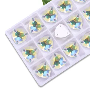 Detailed view of fat triangle AB glass sew-on rhinestones, sparkling crystal DIY craft gems.