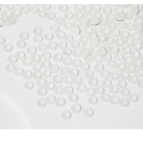 Detail shot of clear flatback rhinestones, transparent crystal gems for DIY crafts and apparel.