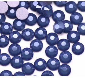 Close-up detail of dark blue flatback rhinestones, perfect for nail art and DIY phone cases.