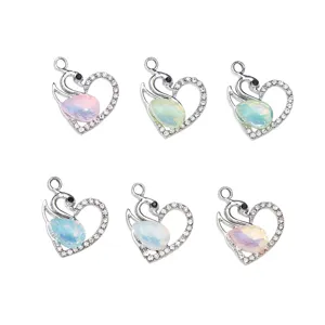 Silver-tone swan heart rhinestone charms with colorful opal teardrop pendants, 6-piece set.