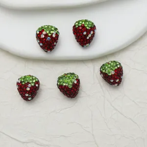 Close-up detail shot of sparkling strawberry rhinestone DIY beads, perfect for custom jewelry.