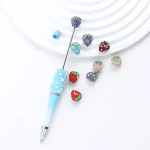 Rhinestone strawberry diamond painting pen set with colorful loose beads for DIY crafts.