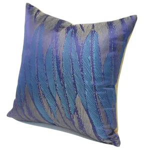 Detailed view of modern Nordic abstract feather pattern throw pillow, blue and purple fabric.