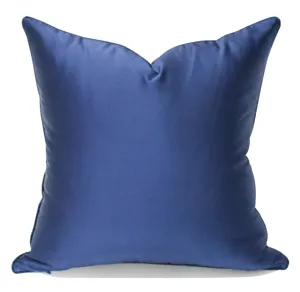 Detailed view of a soft blue square throw pillow cover, elegant home decor accent piece.