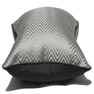 Silver gray chevron pattern sofa throw pillow cover, modern luxury cushion cover detail.