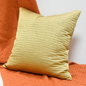 Gold square throw pillow with jacquard texture, perfect for sofa and hotel decor main view.