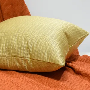 Gold square throw pillow with geometric jacquard texture for sofa home decor main view