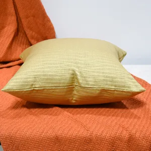 Golden sofa square throw pillow geometric jacquard cushion for hotel living room decor.