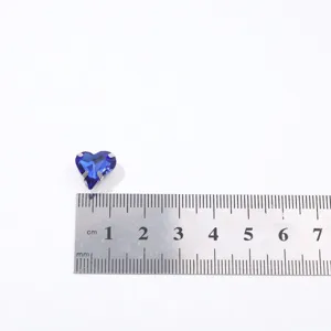 Blue heart crystal shaped 4-prong claw drill DIY jewelry accessory size detail view.