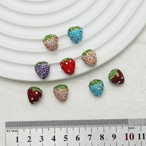 Detailed view of colorful rhinestone strawberry beads DIY jewelry making accessories.