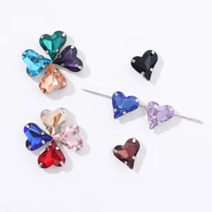 Detailed view of heart-shaped crystal glass claw rhinestones for DIY jewelry and crafts.