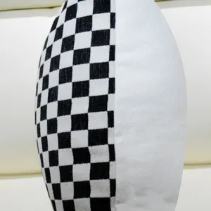 Black and white checkered cushion cover detail, Nordic style modern sofa pillow interior.