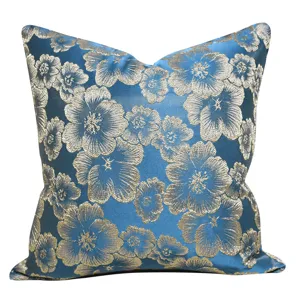 Jacquard floral cushion cover detail view, blue luxury throw pillow fabric texture.