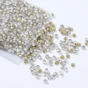 Pointed back rhinestones clear and gold crystal diamonds for nail art and DIY phone cases.