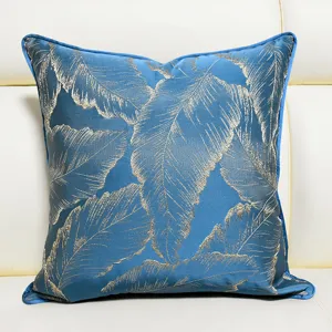 Luxury blue throw pillow cover with golden leaf jacquard design, elegant cushion.
