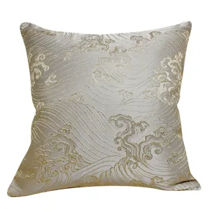 Close-up detail of the luxury jacquard throw pillow cover featuring golden wave patterns.