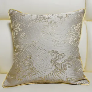 Detail view of a luxury jacquard cushion cover with exquisite gold wave embroidery.
