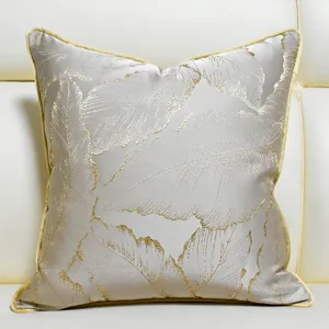 Luxury jacquard throw pillow cover with golden leaf pattern, elegant cushion for sofa decor.