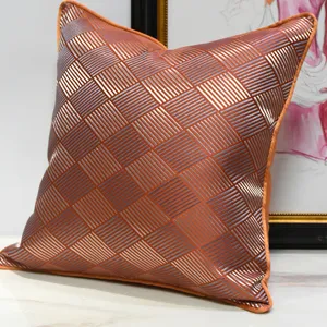Modern luxury orange geometric throw pillow cover with metallic silver striped diamond pattern.