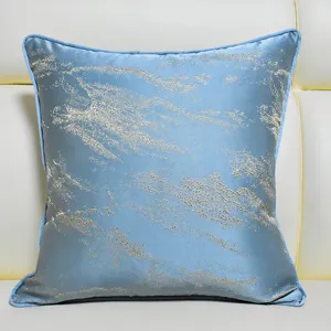 Blue gold abstract decorative pillow detail shot soft luxury cushion cover aesthetic interior decor.