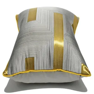 Close-up of the modern grey and gold geometric throw pillow cover featuring stylish stripes.