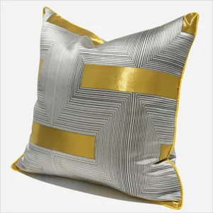 Modern grey and gold geometric throw pillow cover for living room and bedroom decor.