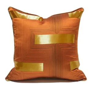 Luxury orange gold geometric cushion cover, elegant satin sofa pillowcase for home decor.