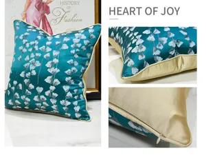 Housse de coussin décorative à fleurs bleu-vert pour canapé de salon, style champêtre.