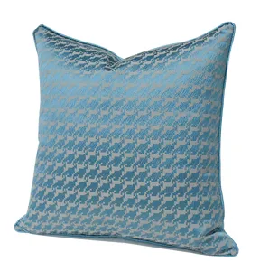 Close-up detail of the luxurious blue houndstooth throw pillow cover fabric texture.