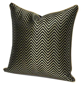 Detailed view of the black and gold chevron pillowcase, modern geometric cushion cover.