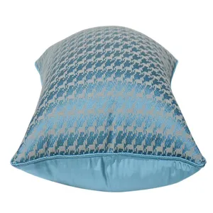 Blue houndstooth throw pillow cover for sofa and bed, luxury geometric cushion detail.