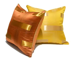Luxury geometric throw pillow cover detail, modern orange and gold satin decorative cushion case.