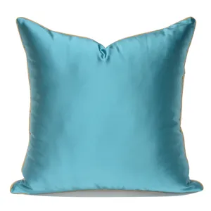 Luxury blue silk cushion cover with gold piping, elegant decorative throw pillow for sofa bed.