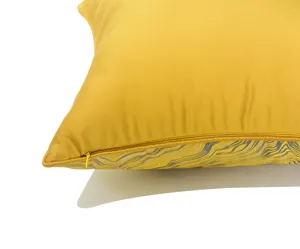 Detail shot of yellow pillowcase showcasing fine zipper craftsmanship and wave pattern.