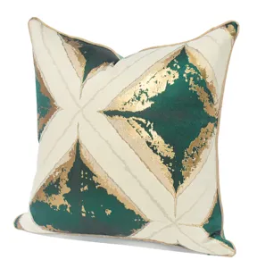 Detail shot of luxury green and gold geometric cushion cover, perfect for modern sofa decor.