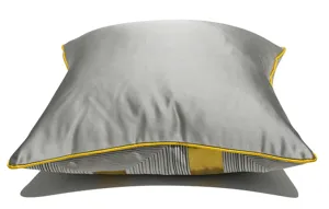 Modern gray and gold throw pillow detail, luxury velvet or satin fabric with bright yellow piping.