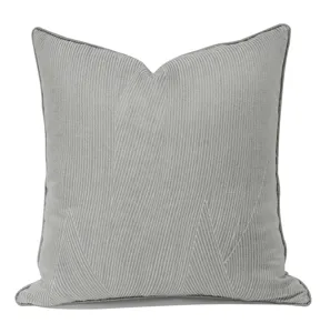 Blue grey striped throw pillow cover detail, modern minimalist cushion case close-up view.