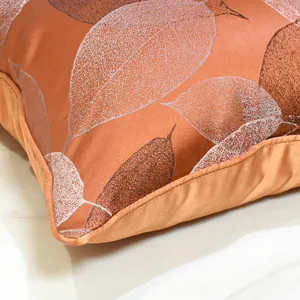 Funda de cojín decorativa con patrón de hojas naranja kaki de lujo para sofá hogar.