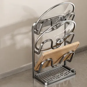 Stainless steel kitchen pot lid rack and cutting board holder stand for countertop organization.