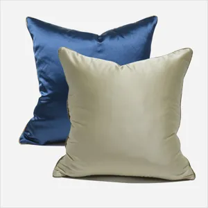 Luxury satin throw pillow covers set of two in deep blue and beige for living room decor.